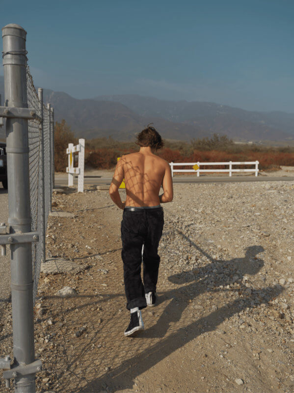 Cameron Dallas walks along a dirt path in Los Angeles photographed by Steven Taylor for People Magazine