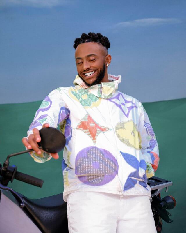Aminé styled in a Louis Vuitton jacket and Edwin Denim pants photographed by Steven Taylor