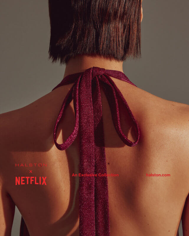 Detail of the Halston x Netflix pleated fuschia gown with an adjustable neck tie photographed by Steven Taylor